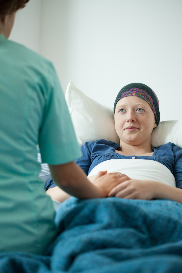 Nurse talking with woman with cancer