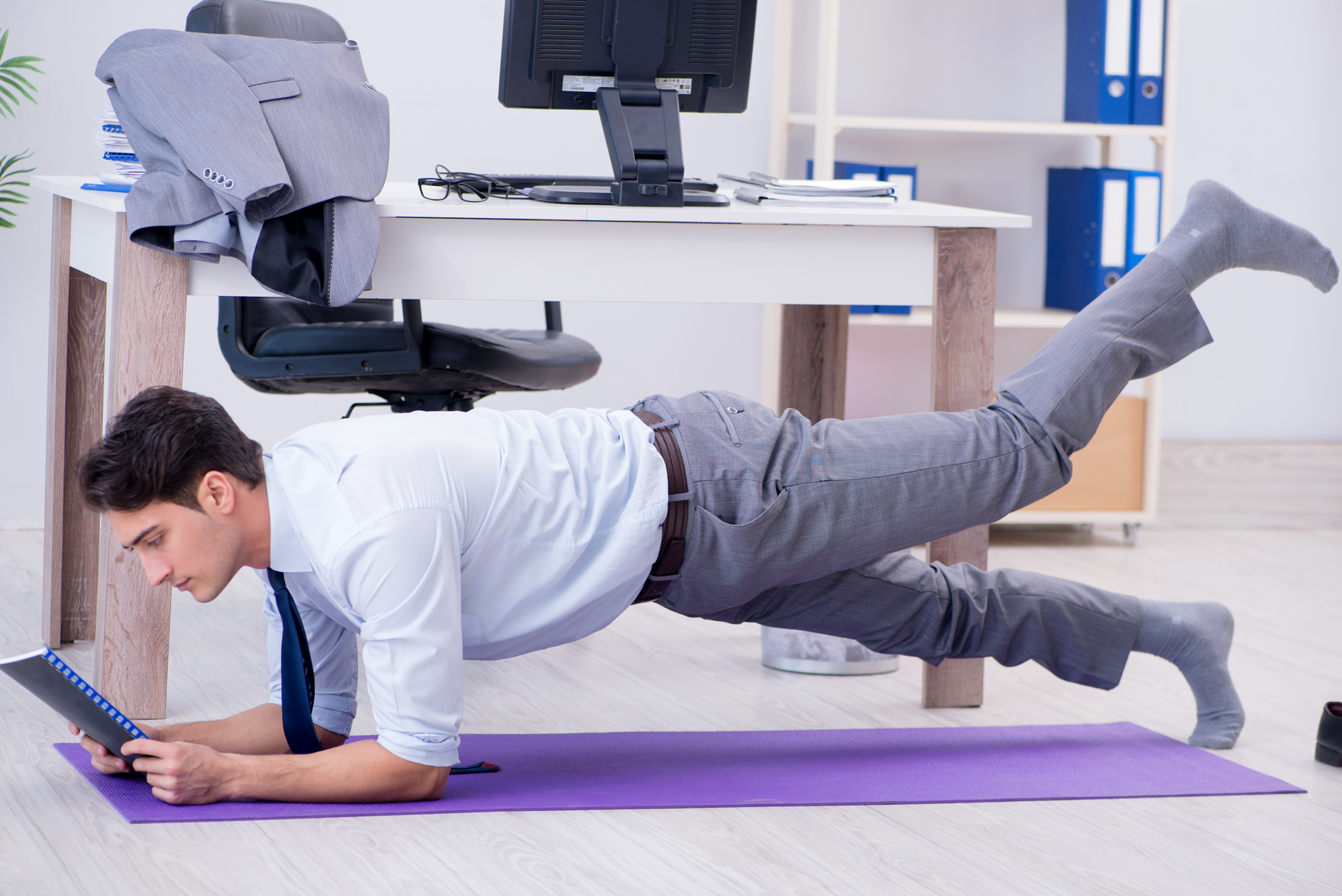 Businessman Doing Sports in Office during Break